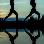 Two women doing yoga