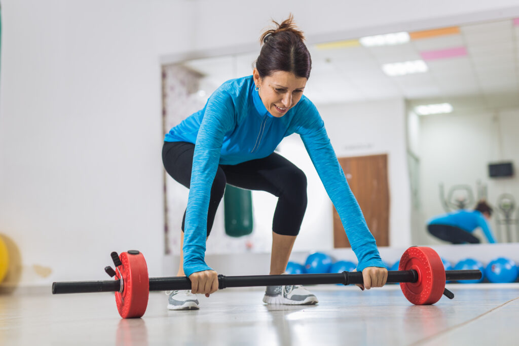 A middle ages woman weight lifting