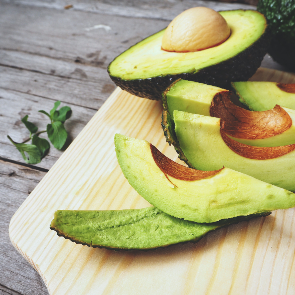 potassium-rich avocado sliced on a cutting tray