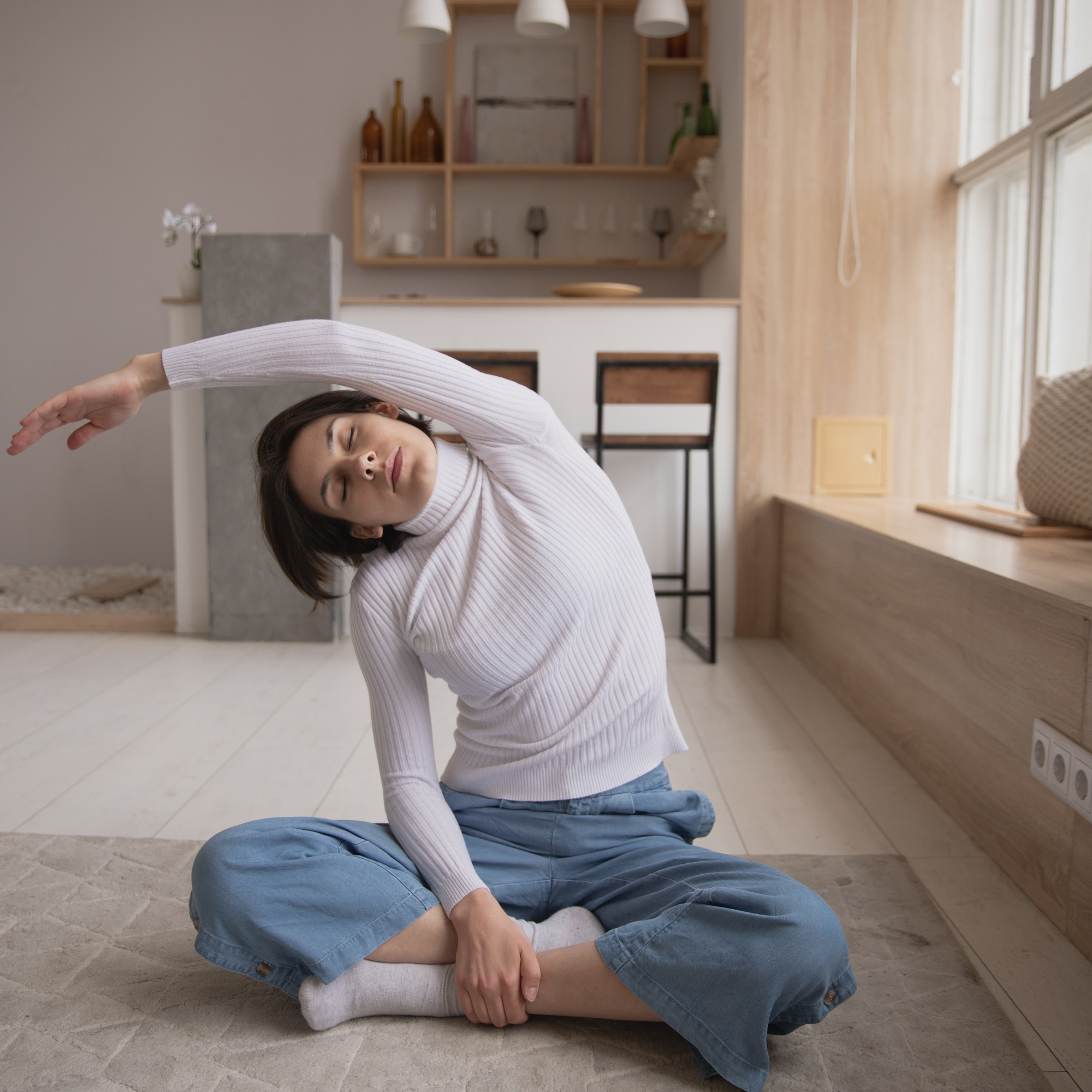 a woman doing a side stretch